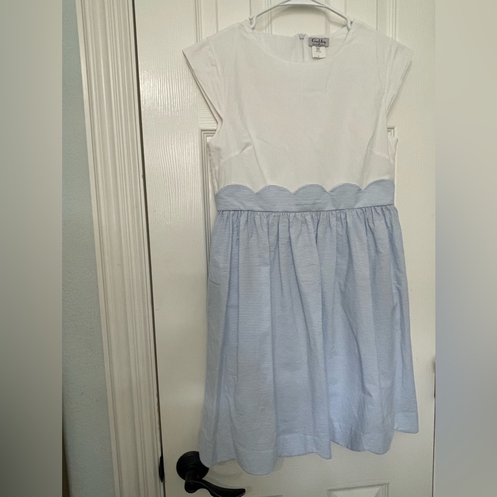 Color blocking dress with stripped skit and white top.
